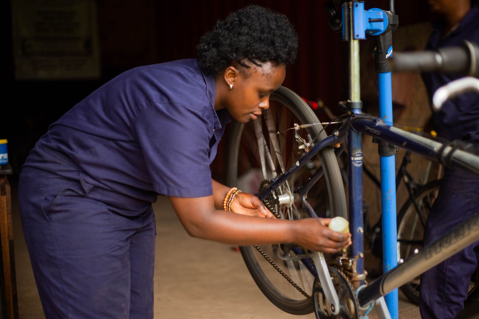 Bicycle mechanic working at a repair stand